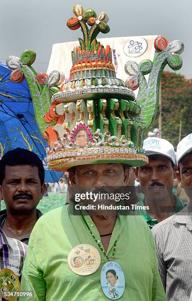 Supporter wearing designed hat symbolising victory of West Bengal Chief Minister Mamata Banerjee during her oath taking ceremony on May 27, 2016 in...