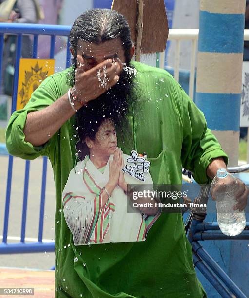 Supporter with cutout of West Bengal Chief Minister Mamata Banerjee during her oath taking ceremony on May 27, 2016 in Kolkata, India. The presence...