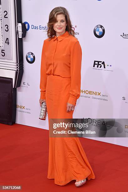 Marie Baeumer, wearing a dress by Lala Berlin and bag by Jimmy Choo, attends the Lola - German Film Award on May 27, 2016 in Berlin, Germany.