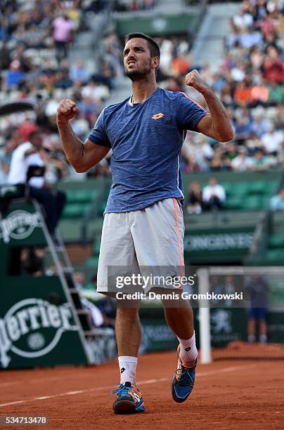 Viktor Troicki of Serbia celebrates victory during the Men's Singles third round match against Gilles Simon of France on day six of the 2016 French...
