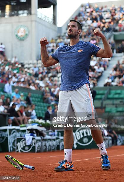 Viktor Troicki of Serbia celebrates victory during the Men's Singles third round match against Gilles Simon of France on day six of the 2016 French...