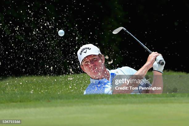 Derek Fathauer hits a shot out of the sand on the 11th hole during the Second Round of the DEAN & DELUCA Invitational at Colonial Country Club on May...