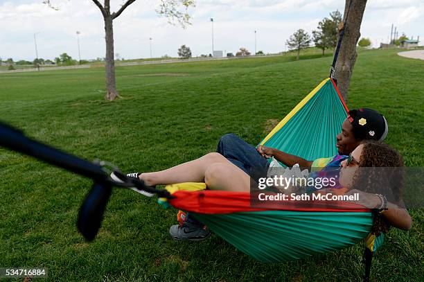 Brittany Cruzan and Ronnie Reyes relax in a hammock as they take in the view at Heritage Park in Highlands Ranch, Colorado on May 25, 2016. Douglas...