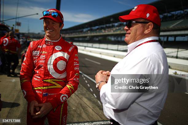 Scott Dixon of New Zealand, driver of the Target Chip Ganassi Racing Chevrolet, talks with team owner Chip Ganassi as he prepares to drive on Carb...