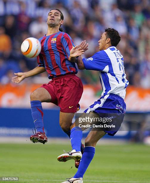 Rafael Marquez of F.C Barcelona controls the ball beside Nene of Alaves during a Primera Liga soccer match between Alaves and F.C. Barcelona at the...