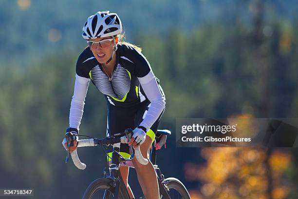 road cyclist girl - facing challenge stock pictures, royalty-free photos & images