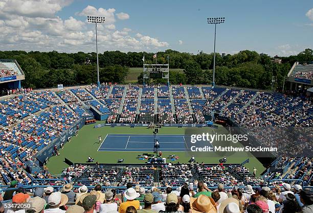 Amelie Mauresmo of France serves to Lindsay Davenport during the final of the Pilot Pen Tennis tournament on August 27, 2005 at the Connecticut...