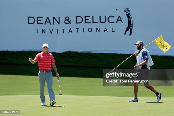 Jordan Spieth waves to the gallery after making a putt for birdie on the 13th green during the Second Round of the DEAN & DELUCA Invitational at...