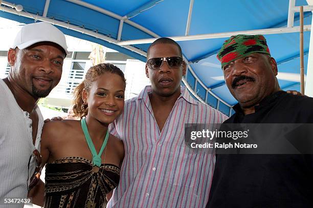 Floyd Raglin, singer Christina Milian, Jay-Z and Jim Brown attend the Ocean Drive Magazine lounge August 27, 2005 in Miami Beach, Florida.