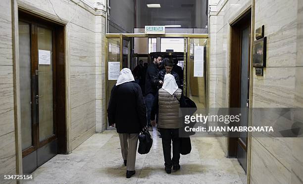 Members of Human Rights organization Madres de Plaza de Mayo linea Fundadora, Nora Cortinas and Mirta Baravalle, walk to the court room to hear the...