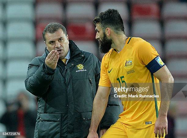 Australia manager Ange Postecoglou talk to Mile Jedinak at the final whistle during the International Friendly match between England and Australia at...