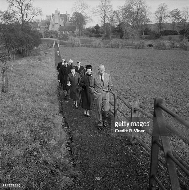 Prince Henry, Duke of Gloucester and Princess Alice, Duchess of Gloucester walk with their children, Prince William of Gloucester and Prince Richard,...