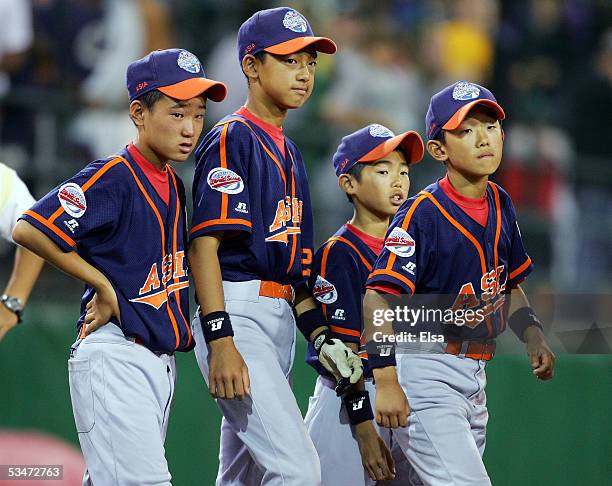 The Asia team lines up to shake hands with the winning Caribbean team after the International Final of the Little League World Series on August 27,...