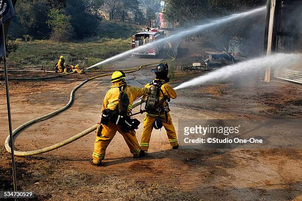 structure fire - firehoses stock pictures, royalty-free photos & images