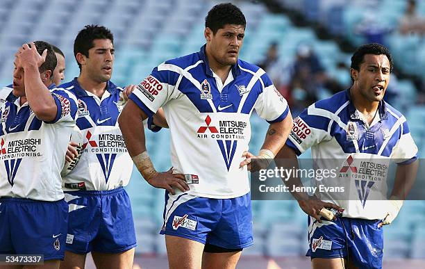 Dejected Bulldogs Corey Hughes,Braith Anasta, Willie Mason and Roy Asotasi during the round 25 NRL match between the Bulldogs and the Penrith...