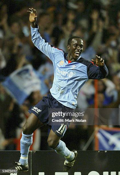 Dwight Yorke celebrates scoring a goal during the round one A-League match between the Sydney FC and Melbourne Victory at Aussie Stadium on August...