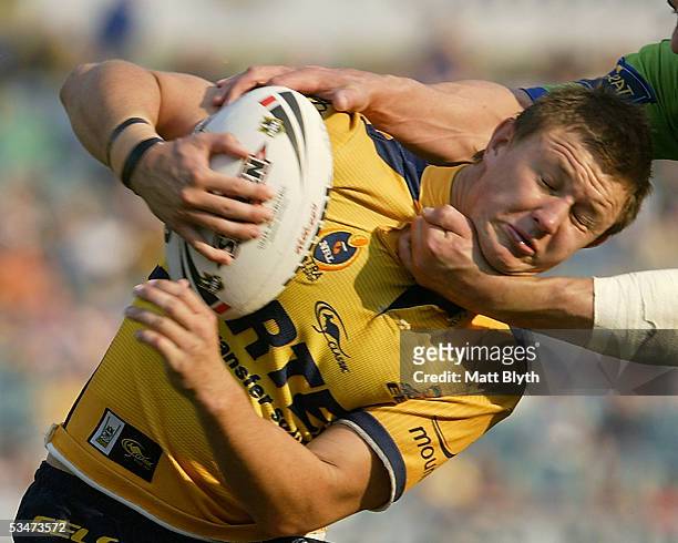 Tim Smith of the Eels is tackled by the head during the round 25 NRL match between the Parramatta Eels and the Canberra Raiders at Parramatta Stadium...