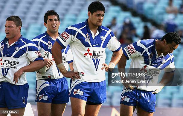 Dejected Bulldogs Corey Hughes,Braith Anasta, Willie Mason and Roy Asotasi during the round 25 NRL match between the Bulldogs and the Penrith...