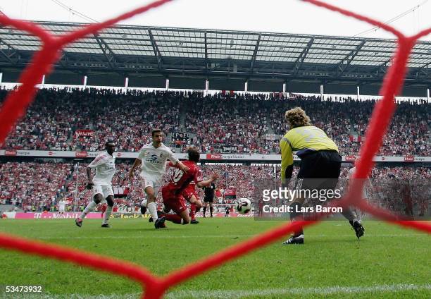Christian Springer of Cologne fouls Ferydoon Zandi of Kaiserslautern and Referee Helmut Fleischers gives penalty during the Bundesliga match between...