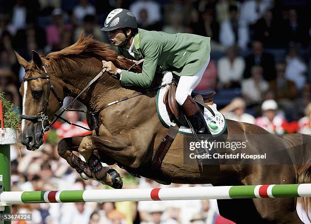 Rodrigo Pessoa of Brazil jumps on Baloubet du Rouet in the show jump discipline of the S16 Great Price of Aachen during the CHIO Aachen 2005 Grand...