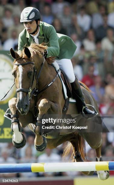 Rodrigo Pessoa of Brazil jumps on Baloubet du Rouet in the show jump discipline of the S16 Great Pirce of Aachen during the CHIO Aachen 2005 Grand...