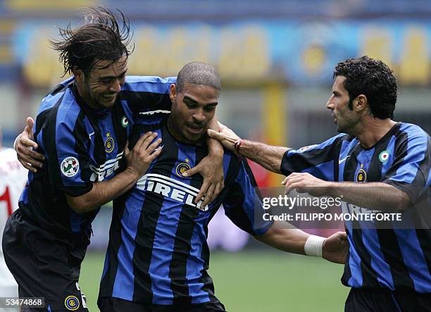 Inter Milan Adriano of Brazil celebrates with his teammates Alvaro Recoba of Uruguay and Figo of Portugal after scoring his first goal during their...