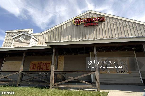 An adult nightclub is seen boarded up prior to Hurricane Katrina making landfall August 28, 2005 in Biloxi, Mississippi. A mandatory evacuation order...