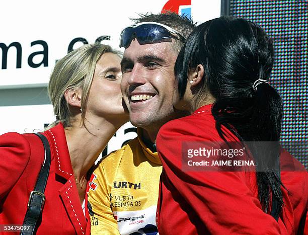 Australia's Bradley McGee of Francaise Des Jeux is kissed on the podium after becoming the new leader after the end of the second stage of the Tour...