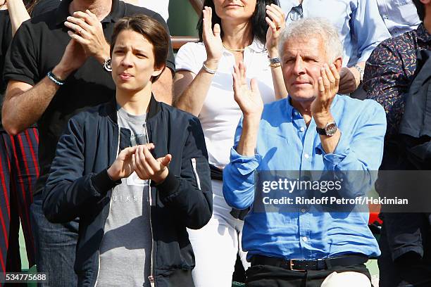 Patrick Poivre d Arvor and guest attend the French Tennis Open Day 6 at Roland Garros on May 27, 2016 in Paris, France.