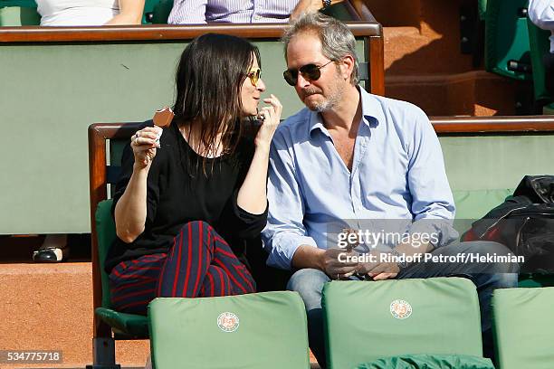 Christopher Thompson and Geraldine Pailhas attend the French Tennis Open Day 6 at Roland Garros on May 27, 2016 in Paris, France.