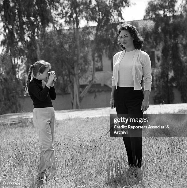 Greek-born Italian actress Yvonne Sanson being photographed by her daughter Gianna Spirito in the garden of her villa on the Appian Way in Rome....