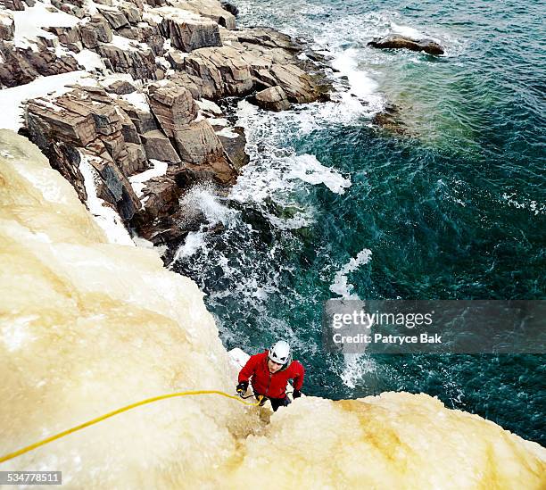 winter ice climbing in acadia park - rock climbing stock-fotos und bilder