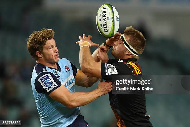 Michael Hooper of the Waratahs and Sam Cane of the Chiefs compete for the ball during the round 14 Super Rugby match between the Waratahs and the...