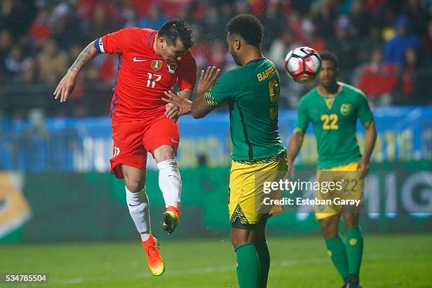 Gary Medel of Chile fights for the ball with Giles Barnes of Jamaica during an international friendly match between Chile and Jamaica at Sausalito...
