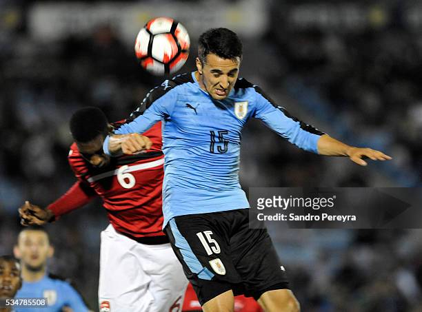 Matias Vecino of Uruguay and Weslie John of Trinidad Tobago fight for the ball during an international friendly match between Uruguay and Trinidad &...