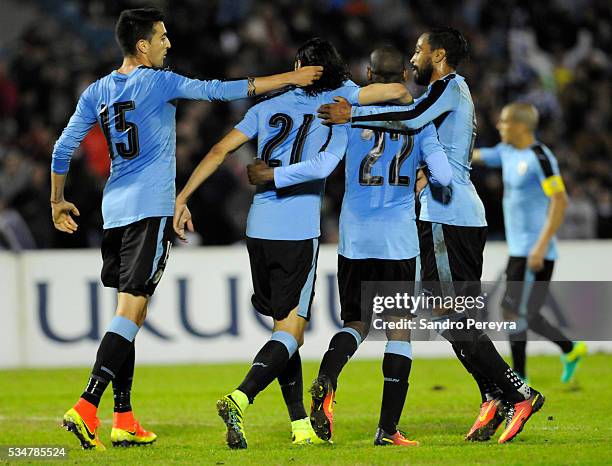 Players of Uruguay celebrate their second goal during an international friendly match between Uruguay and Trinidad & Tobago at Centenario Stadium on...