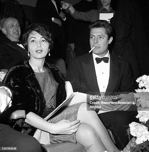 Italian actor Marcello Mastroianni attending the Nastro d'Argento awarding ceremony with his wife Flora Carabella. 1958