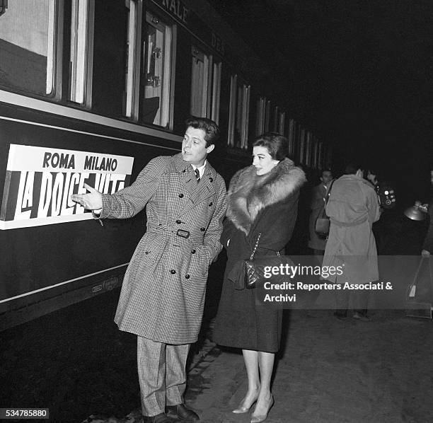 Italian actor Marcello Mastroianni and French actress Anouk Aimée about leaving from Termini railway station to Milan for the premiere of the film La...