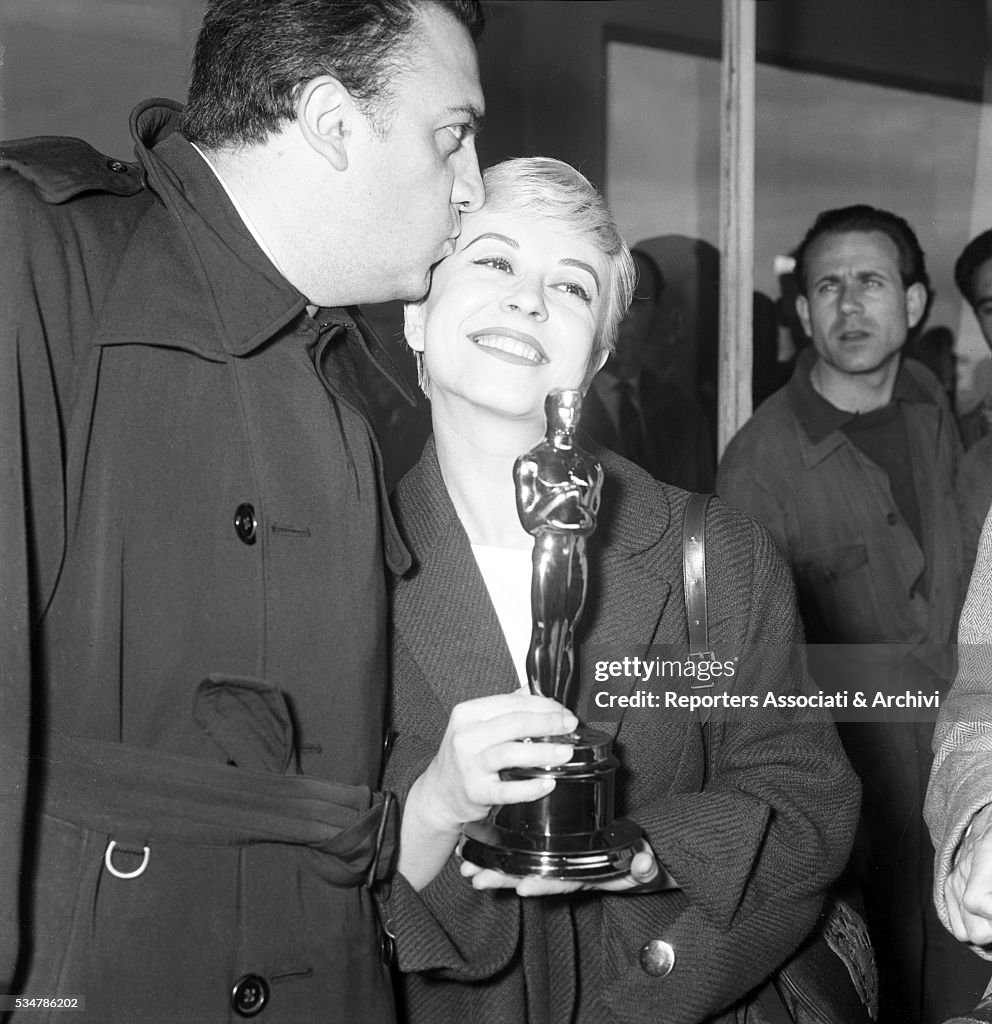 Federico Fellini and Giulietta Masina at Ciampino Airport