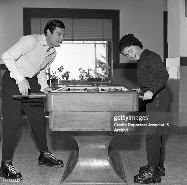 Italian actor Marcello Mastroianni and his daughter Barbara playing table football during their holiday in a village on the Mount Terminillo. Italy,...