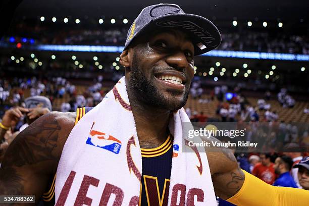 LeBron James of the Cleveland Cavaliers celebrates their 113 to 87 win over the Toronto Raptors in game six of the Eastern Conference Finals during...