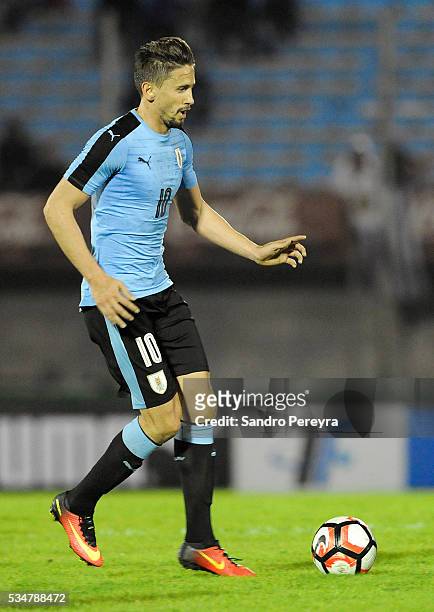 Gaston Ramirez of Uruguay drives the ball during an international friendly match between Uruguay and Trinidad & Tobago at Centenario Stadium on May...