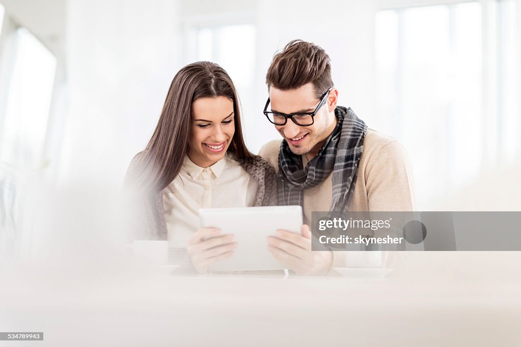 Couple using touchpad.