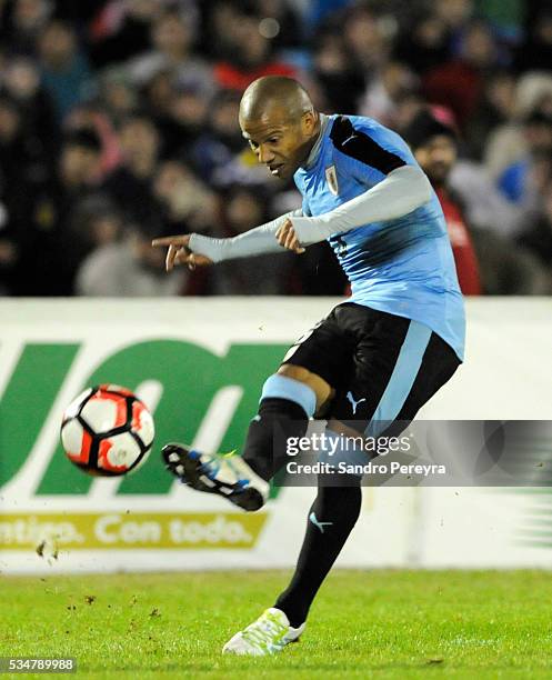 Carlos Sanchez of Uruguay kicks the ball during an international friendly match between Uruguay and Trinidad & Tobago at Centenario Stadium on May...