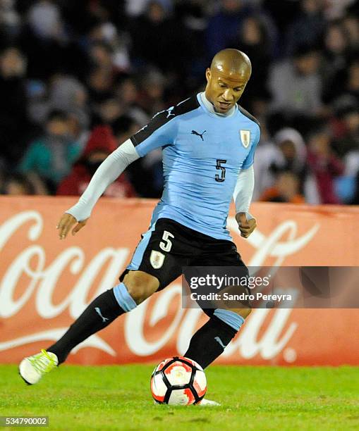 Carlos Sanchez of Uruguay drives the ball during an international friendly match between Uruguay and Trinidad & Tobago at Centenario Stadium on May...