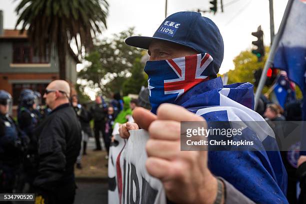 Member of the True Blue Crew baits the left leaning Anti Racism supporters from behind police lines at on May 28, 2016 in Melbourne, Australia....