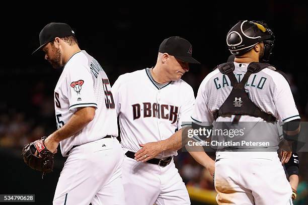 Relief pitcher Josh Collmenter of the Arizona Diamondbacks is removed by manager Chip Hale during the sixth inning of the MLB game against the San...