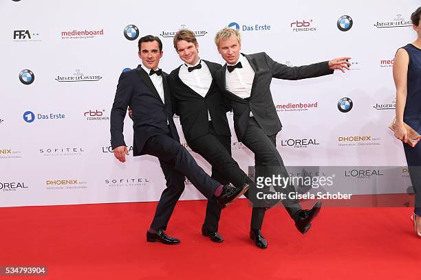 Hannes Wegener, Tobias Schenke and Robert Stadlober dance during the Lola - German Film Award 2016 on May 27, 2016 in Berlin, Germany.
