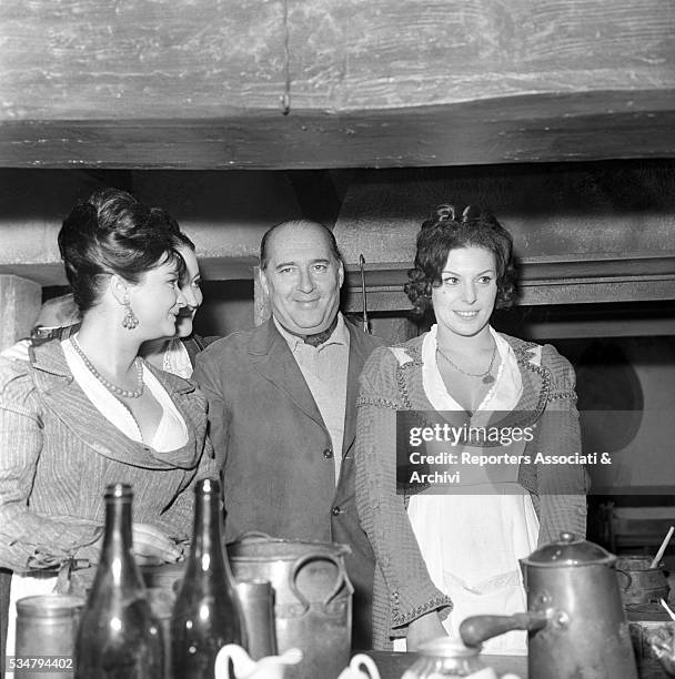 Italian director Roberto Rossellini, French actress Martine Carol and American actress and soprano Anna Moffo attending a party held for the film The...