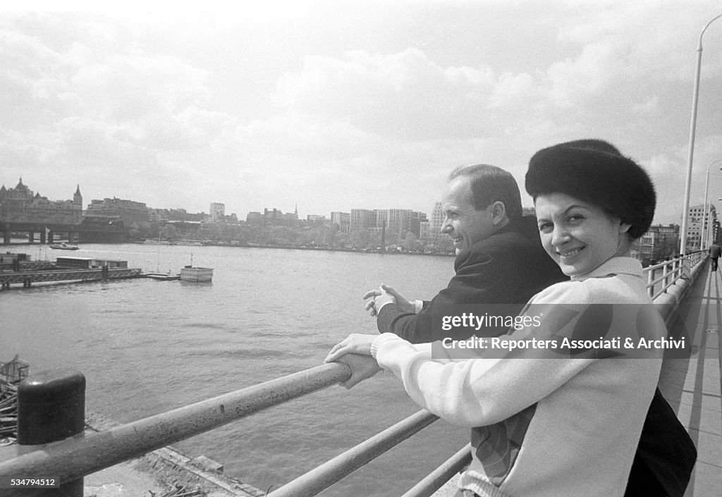 Carla Fracci and Beppe Menegatti watching the Thames River